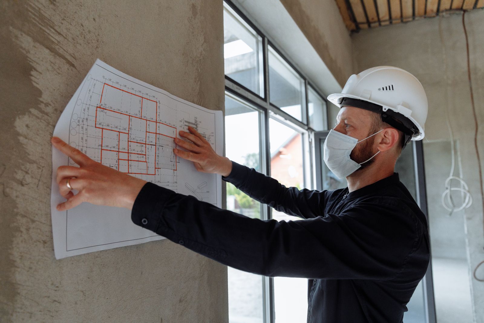 Reviewing drawings on site before an inspection